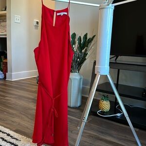Red dress with cute ruffle cut outs on the side. Perfect flowy fit for summer!